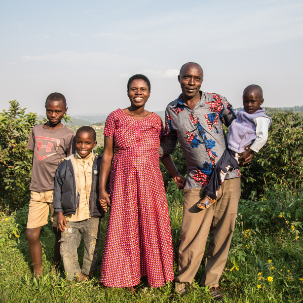 Family gathered for a photo on their coffee farm in Rwanda.