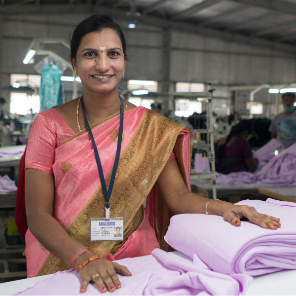 AQuality Checker in one of the sewing lines at Bestitch Knits, a fair Trade Certified Factory.