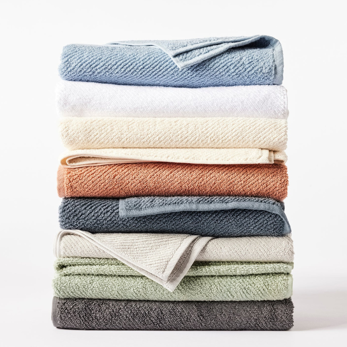 A stack of Coyuchi - Air weight organic towels