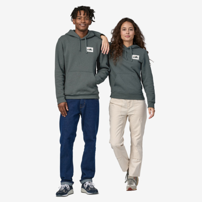 Male and Female standing next to each other wearing identical hoodies from Patagonia.